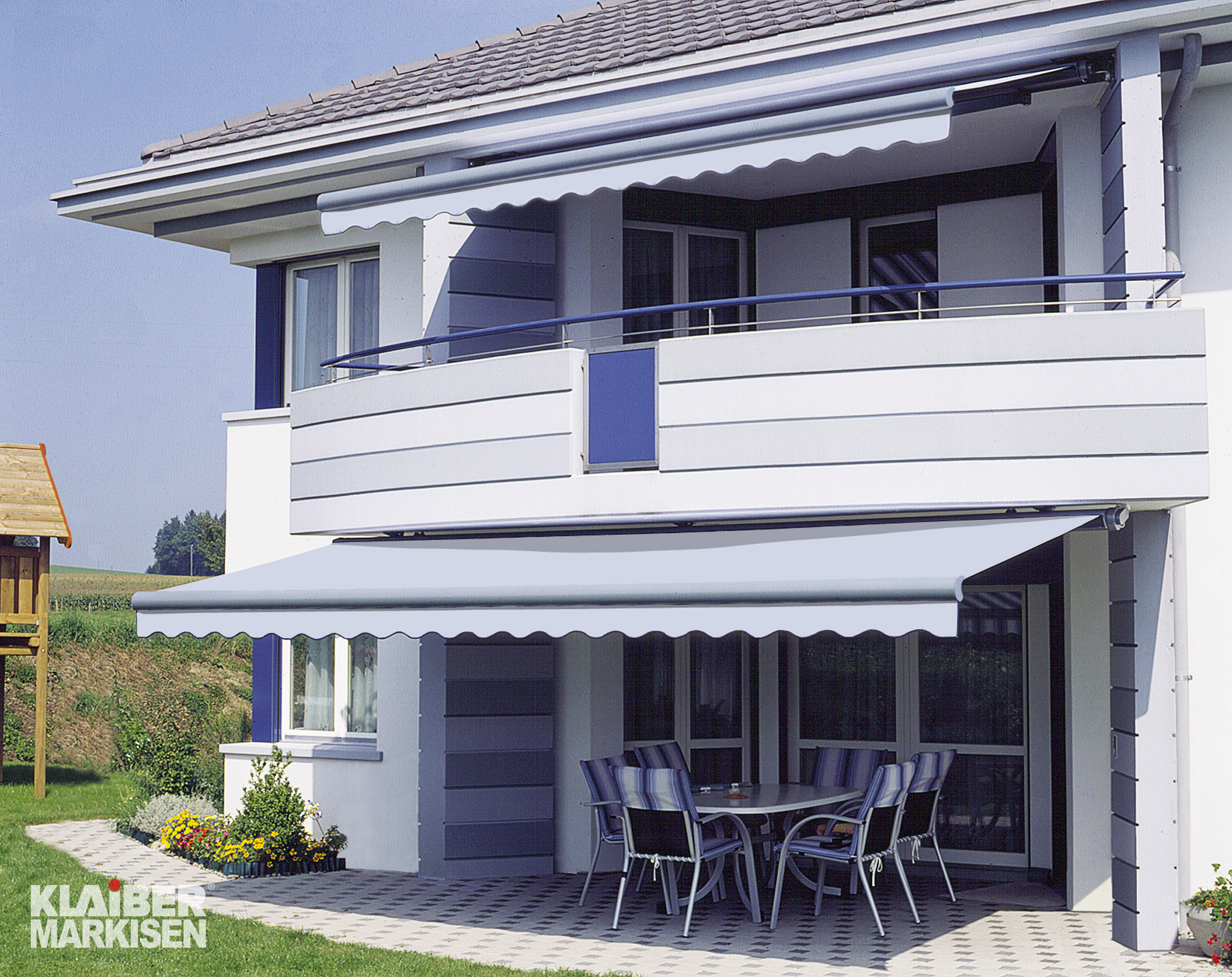Two each of gray, white, and black shirts laying flat.