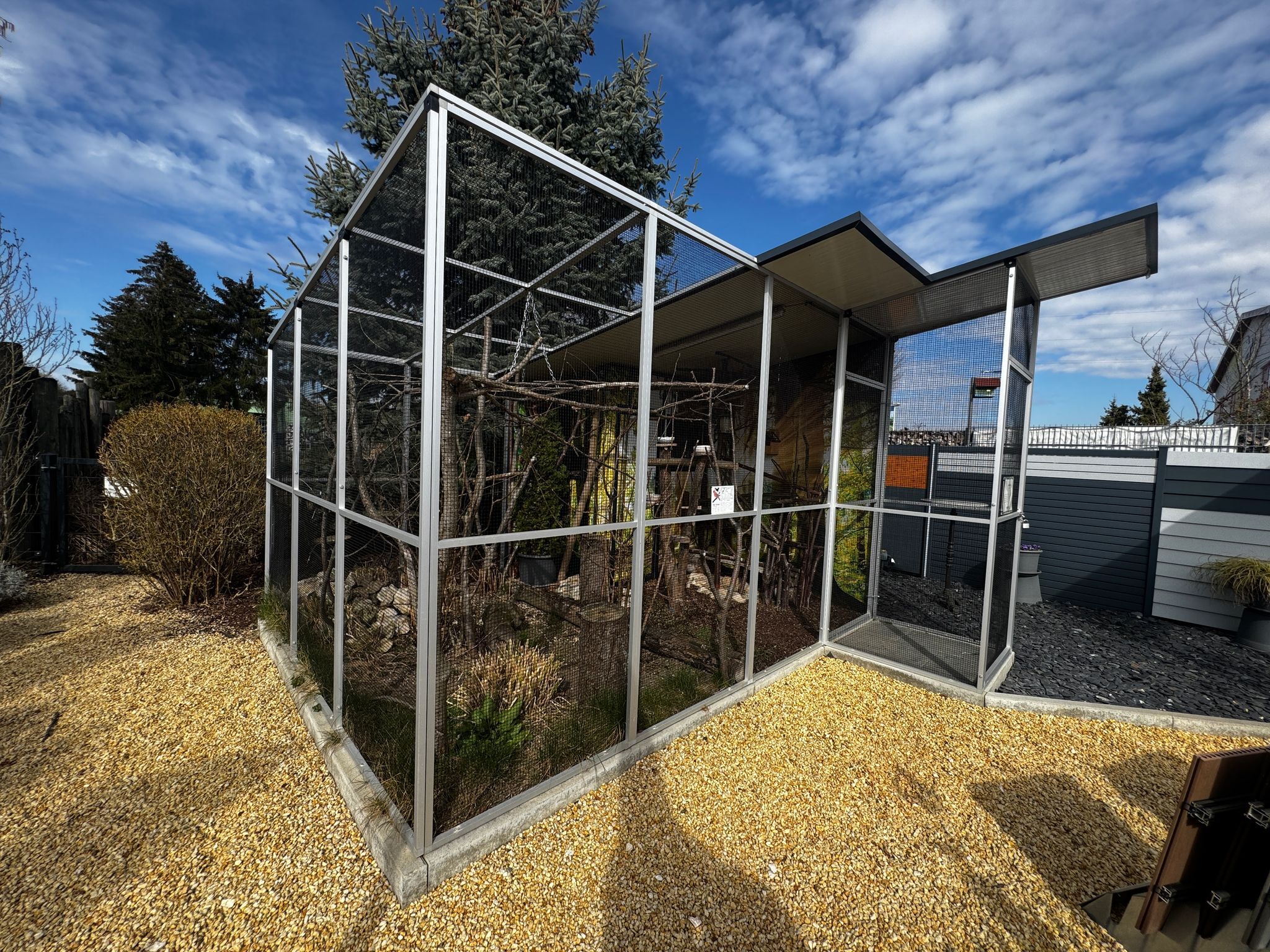 Two each of gray, white, and black shirts laying flat.